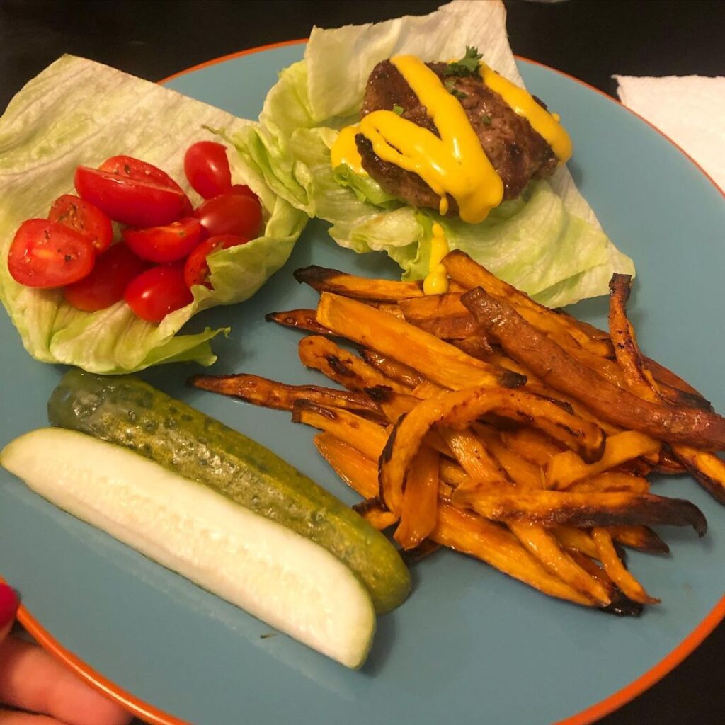 Bunless burgers with baked sweet potato fries and some leftover cucumber salad (…