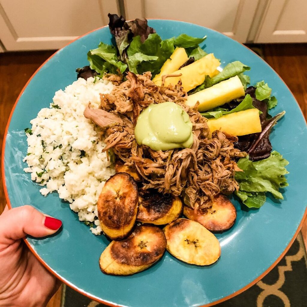 Carnitas bowls (on a messy plate) from 

Mixed greens, plantains, coconut caulif…