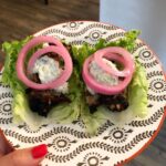 Greek turkey burgers formed with spinach, red onion, feta, sun dried tomatoes, h…