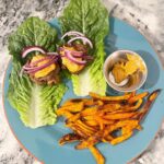 Lettuce wrap sliders with carrot and sweet potato “fries,” served with chipotle …