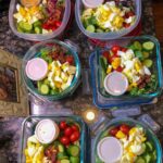 Lunches prepped for the week  

Cobb salads with mixed greens, cherry tomatoes, …