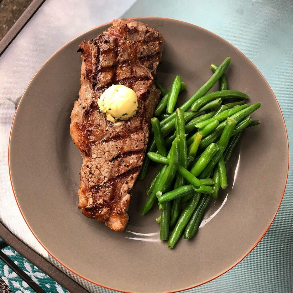 Medium rare New York strip off the grill, steamed green beans, and a homemade he…
