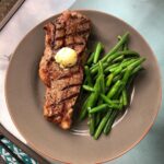 Medium rare New York strip off the grill, steamed green beans, and a homemade he…