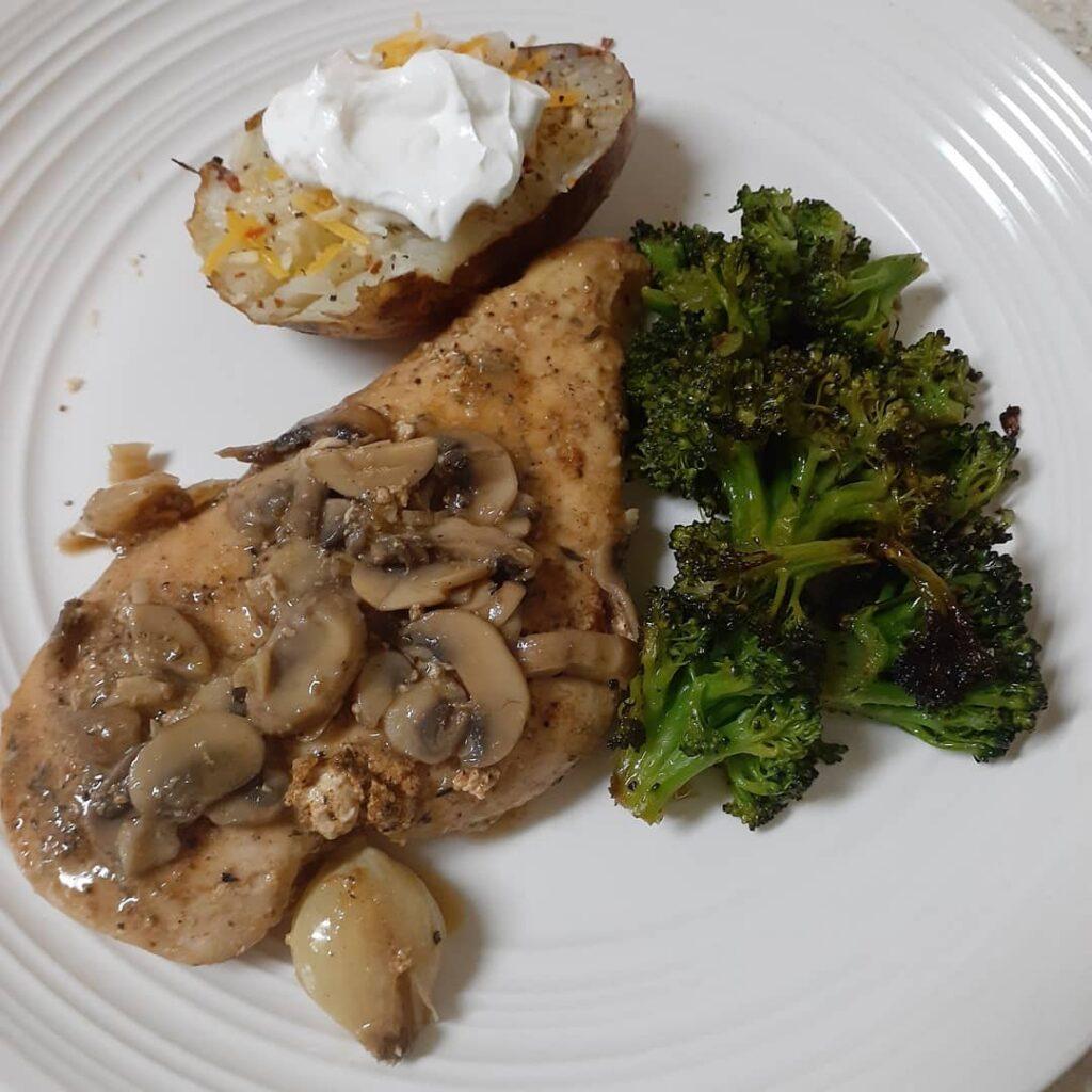 Sousvide chicken breast with a mushroom white wine sauce, broccoli, and air frie…