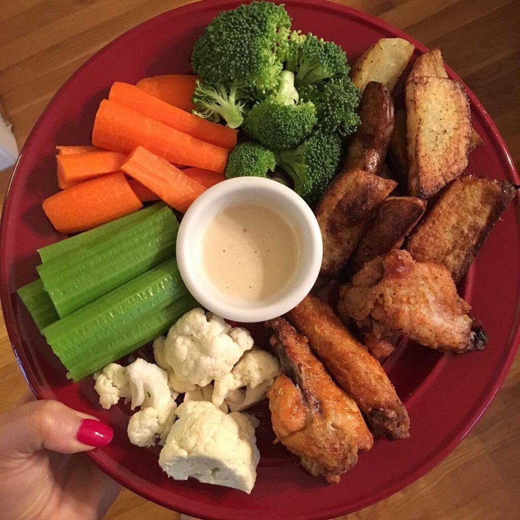 This paleo buffalo wings and veggie platter made an epic dinner. The potato wedg…